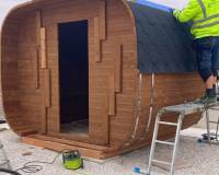 Cubus sauna with wood burning heater assembly